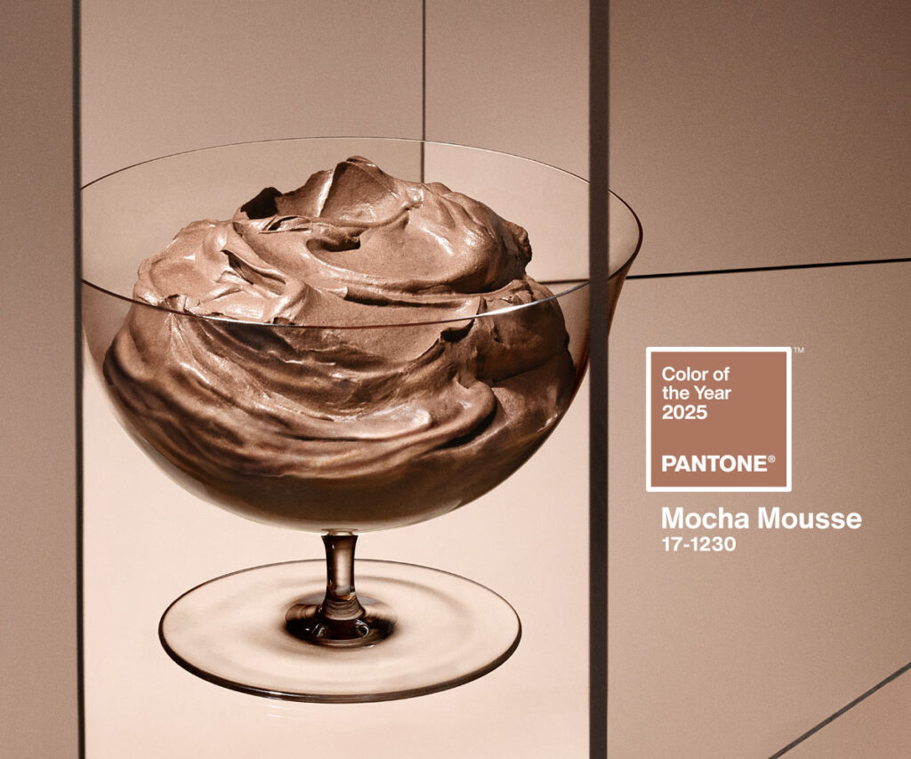 Image of a glass cup of creamy coffe and chocolate icecream evoking Mocha Mousse, Pantone Coloro of the year 2025, on a background of shades from beige to mocha.