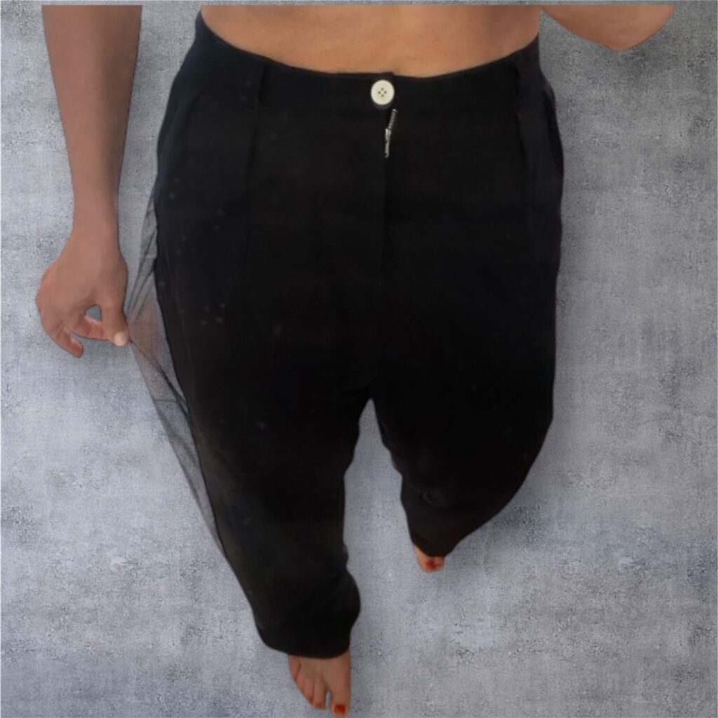 image of a woman wearing The double-layered trousers by Miaoran; colour navymesh over an ink-black layer